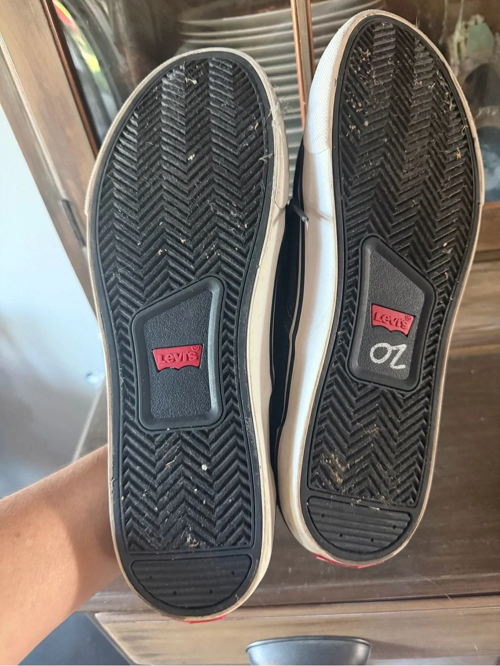 Levi's Black Canvas Low-Top Sneakers with Brown Heel Accent and White Sole